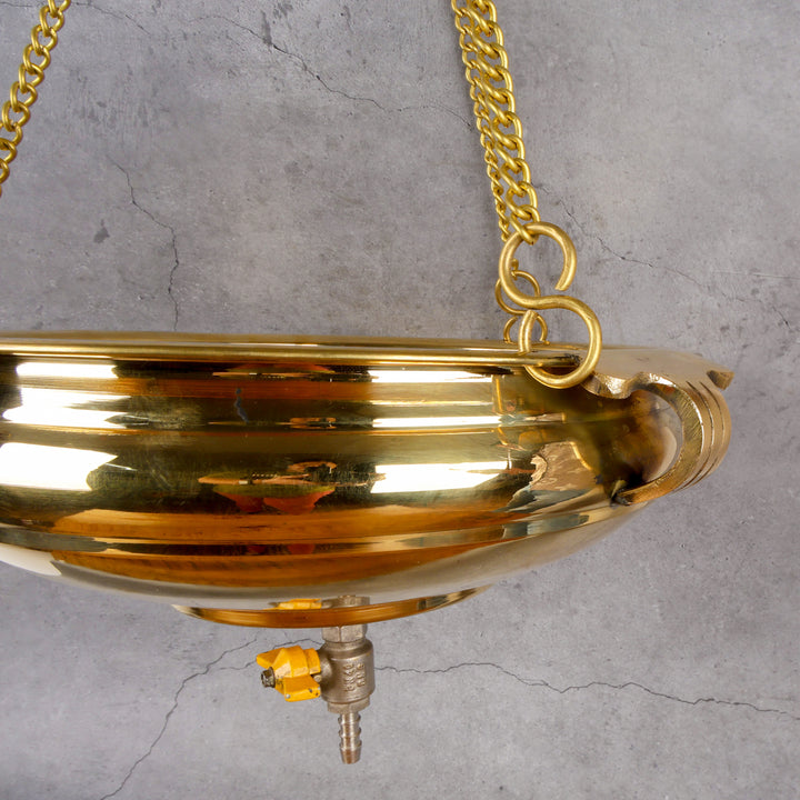 Brass shirodhara pot Ayurveda therapy — close-up