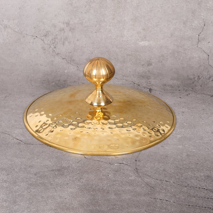 Brass degchi with lid pital cooking pot — lifestyle in-use shot