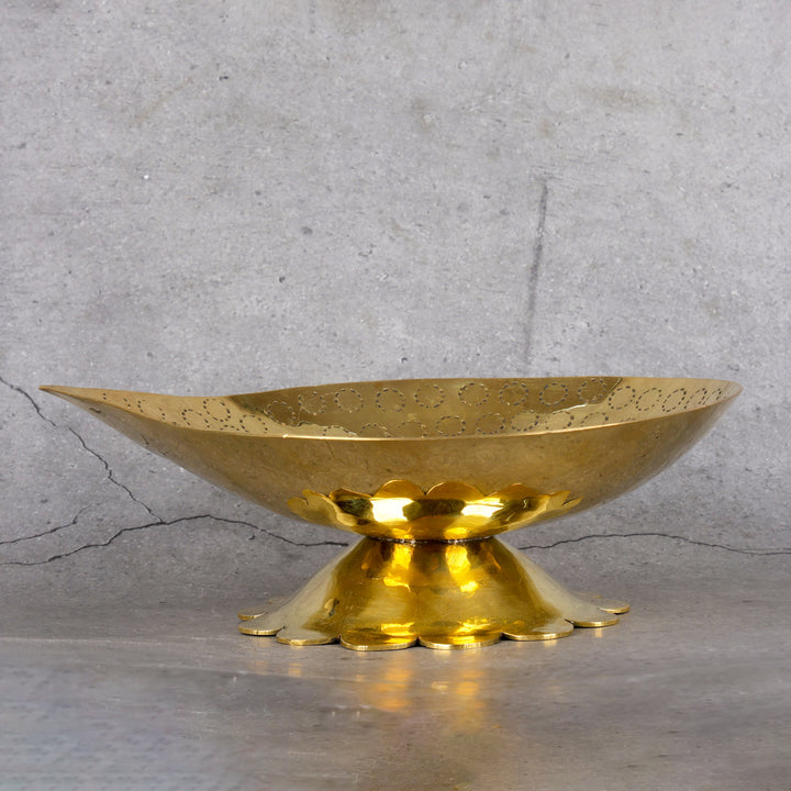 Brass diya pital diya for pooja — lifestyle shot showing product in use