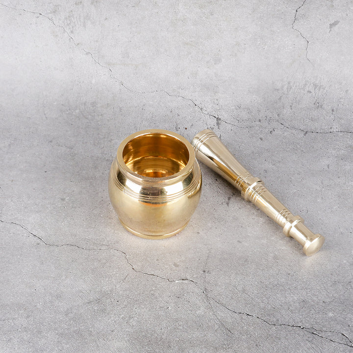 Brass Hamamdasta - Traditional Mortar and Pestle Set - Detailed side angle view showing key features and dimensions.