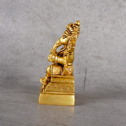 Brass Ganesha Statue - Traditional Elephant Deity - Close-up shot highlighting material