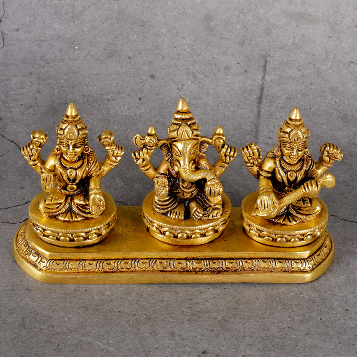 Brass Ganesha Laxmi Saraswati - Trinity Deities Set - Detailed side angle view showing key features and dimensions.